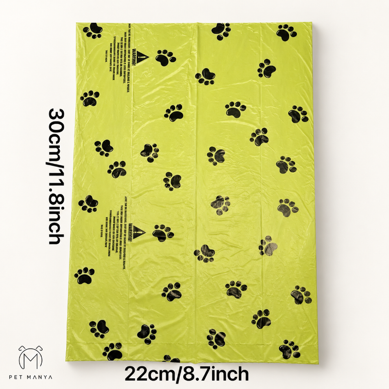 A lime green plastic bag with black paw print patterns, shown flat with dimensions labeled as 30cm/11.8inch tall and 22cm/8.