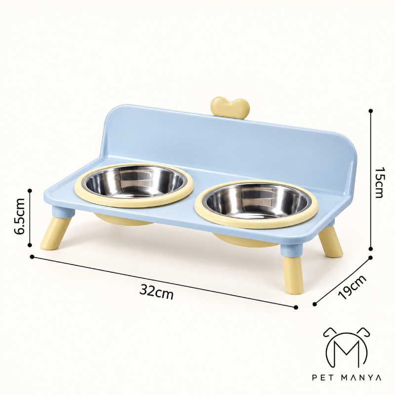 A light blue elevated pet feeder with two stainless steel bowls, shown with dimension lines indicating measurements of 32cm width, 15cm height, 6.5cm bowl depth, and 19cm leg width.